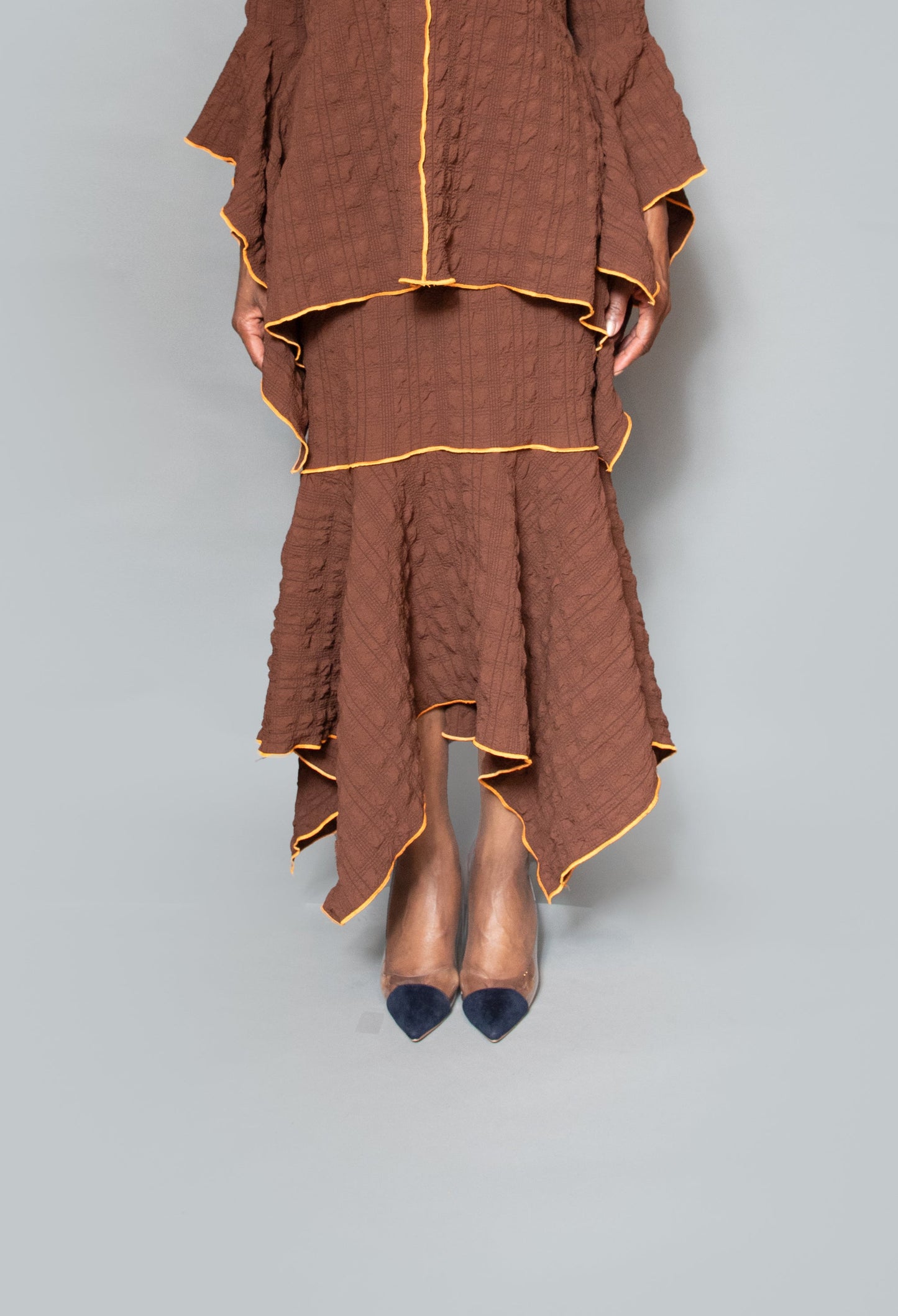 Pull on fit asymmetric hem contrast pearl skirt